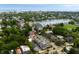 Scenic aerial view highlighting a neighborhood with a pond, tennis courts, and city skyline in the distance at 122 Beaufain St # C, Charleston, SC 29401