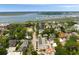 Elevated view of a coastal community featuring picturesque homes, a marina, and a bridge spanning the waterway at 122 Beaufain St # C, Charleston, SC 29401