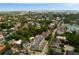 Expansive aerial capturing a city with a lake, a bridge in the distance, and lush green neighborhoods at 122 Beaufain St # C, Charleston, SC 29401