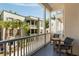 Scenic balcony with seating overlooking lush landscaping and building exteriors at 122 Beaufain St # C, Charleston, SC 29401