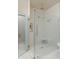 Spa-like bathroom with a frameless glass shower and elegant white herringbone-patterned tile at 122 Beaufain St # C, Charleston, SC 29401