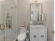 Stylish bathroom with a glass shower and vanity with marble countertop, and modern gold fixtures at 122 Beaufain St # C, Charleston, SC 29401
