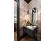 Powder room featuring a modern floating vanity, a beautiful wallpaper and bright lighting at 122 Beaufain St # C, Charleston, SC 29401
