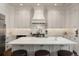 Bright kitchen with a central island, custom cabinetry, and professional-grade appliances at 122 Beaufain St # C, Charleston, SC 29401