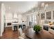 Bright kitchen features a large island with seating, modern appliances, and a view to the outside at 122 Beaufain St # C, Charleston, SC 29401