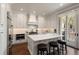 Modern kitchen with a large central island, stainless appliances, and access to a patio at 122 Beaufain St # C, Charleston, SC 29401