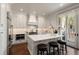 Bright kitchen boasts white cabinets, marble countertops, stainless steel appliances, and a central island at 122 Beaufain St # C, Charleston, SC 29401