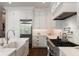 Modern kitchen features stainless steel appliances, white cabinets, and plenty of countertop space at 122 Beaufain St # C, Charleston, SC 29401