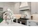 Modern kitchen with stainless appliances, white cabinetry, and sleek marble countertops at 122 Beaufain St # C, Charleston, SC 29401