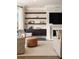 Cozy living room with a fireplace, built-in shelving, and comfortable seating area at 122 Beaufain St # C, Charleston, SC 29401
