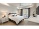 Bright main bedroom with white linen and french doors leading to a private balcony at 122 Beaufain St # C, Charleston, SC 29401