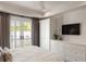 Tranquil main bedroom featuring a balcony, ceiling fan, built-ins and plenty of sunlight at 122 Beaufain St # C, Charleston, SC 29401