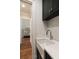 Mudroom featuring built in sink, cabinet storage, and view into an adjoining room at 122 Beaufain St # C, Charleston, SC 29401