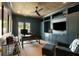 Sophisticated office with built-in bookshelves, a ceiling fan, and outdoor access at 122 Beaufain St # C, Charleston, SC 29401