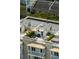 Rooftop terrace features cozy seating, planters, and awning-covered windows, ideal for outdoor living at 122 Beaufain St # C, Charleston, SC 29401
