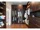 Spacious walk-in closet with mirrored cabinets and a large selection of organized storage at 122 Beaufain St # C, Charleston, SC 29401