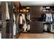 Custom walk-in closet with ample storage space and elegant hardwood flooring at 122 Beaufain St # C, Charleston, SC 29401