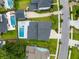 An aerial view highlights the home's private backyard pool and neighborhood street at 1234 Captain Rivers Dr, Charleston, SC 29412