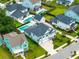 An aerial view showcases the home within a beautiful neighborhood with lush lawns and backyard pools at 1234 Captain Rivers Dr, Charleston, SC 29412