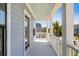 Inviting balcony with blue siding and white railing offering neighborhood views at 1234 Captain Rivers Dr, Charleston, SC 29412