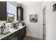 Coffee bar with dark cabinets, a white countertop, decorative artwork, and natural light from the window at 1234 Captain Rivers Dr, Charleston, SC 29412