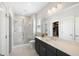 A luxurious bathroom featuring a glass-enclosed shower, sleek vanity, and bright lighting at 1234 Captain Rivers Dr, Charleston, SC 29412