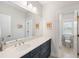 Bright bathroom features a dual-sink vanity and a toilet in a separate water closet at 1234 Captain Rivers Dr, Charleston, SC 29412