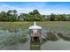 A private wooden dock and gazebo offer serene waterfront views at 1234 Captain Rivers Dr, Charleston, SC 29412