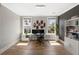 Spacious home office features wood floors, light gray walls, and decor that enhances the room's aesthetic at 1234 Captain Rivers Dr, Charleston, SC 29412