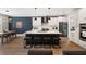 Modern kitchen features a large center island with seating, stainless appliances, and stylish pendant lighting at 1234 Captain Rivers Dr, Charleston, SC 29412