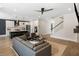 Open-concept living area featuring a modern kitchen, comfortable seating, and a staircase at 1234 Captain Rivers Dr, Charleston, SC 29412