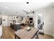Open floor plan featuring a modern kitchen, dining area, and living room with a staircase at 1234 Captain Rivers Dr, Charleston, SC 29412