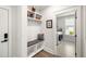 Mudroom features built-in shelving, coat hooks, a bench, and entry into the laundry room with washer and dryer at 1234 Captain Rivers Dr, Charleston, SC 29412