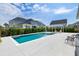 A stunning backyard pool area with lounge chairs, a pergola, and lush greenery at 1234 Captain Rivers Dr, Charleston, SC 29412