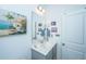 Bathroom with vanity, tropical themed painting, decorative art, and door at 1242 Allusion Ln # 206, Mount Pleasant, SC 29466