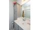 Bright bathroom featuring grey cabinets, a shower with tub, a toilet, and sink at 1242 Allusion Ln # 206, Mount Pleasant, SC 29466