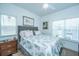 Relaxing bedroom with natural light, artwork, and a comfy bed at 1242 Allusion Ln # 206, Mount Pleasant, SC 29466