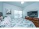 Bright bedroom with a ceiling fan, a TV and a beautiful comforter at 1242 Allusion Ln # 206, Mount Pleasant, SC 29466
