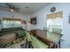 Bright dining area with modern table and seating, open to a comfortable living space at 1242 Allusion Ln # 206, Mount Pleasant, SC 29466