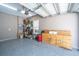 Large garage with epoxy flooring, shelving, and garage door at 1242 Allusion Ln # 206, Mount Pleasant, SC 29466
