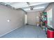 Spacious garage featuring painted walls, epoxy flooring, door, and garage door at 1242 Allusion Ln # 206, Mount Pleasant, SC 29466