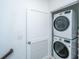 Convenient laundry area with stacked washer and dryer units maximizing space at 1242 Allusion Ln # 206, Mount Pleasant, SC 29466