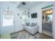Cozy living area with sofa, television, door to outside, and view of bathroom at 1242 Allusion Ln # 206, Mount Pleasant, SC 29466