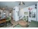 Cozy living room area featuring a chair, shelving unit, and staircase at 1242 Allusion Ln # 206, Mount Pleasant, SC 29466