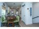 Open-concept space with dining area, living room, and modern kitchen featuring white cabinetry at 1242 Allusion Ln # 206, Mount Pleasant, SC 29466