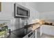 Modern kitchen with stainless steel appliances, granite countertops, and electric cooktop at 1308 Cadet Ct, Mount Pleasant, SC 29466