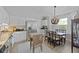 Open kitchen and dining area featuring stainless steel appliances and stylish chandelier at 1308 Cadet Ct, Mount Pleasant, SC 29466