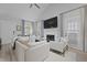 Bright living room featuring a fireplace, vaulted ceilings, and modern decor at 1308 Cadet Ct, Mount Pleasant, SC 29466