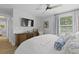 Inviting main bedroom featuring a large TV, dresser and plush bedding and decor at 1308 Cadet Ct, Mount Pleasant, SC 29466