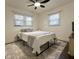 Bedroom features neutral gray and white bedding and a decorative rug at 1329 Camp Rd, Charleston, SC 29412